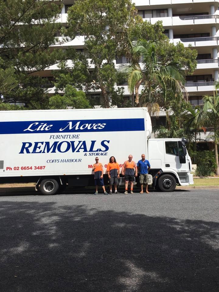 Four Movers Men With Orange And Blue Uniforms With Big Truck — Lite Moves Furniture Removals In Bonville, NSW