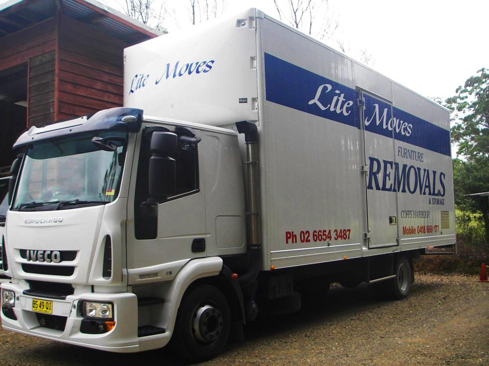 Moving Truck Parked In Front Of A House 