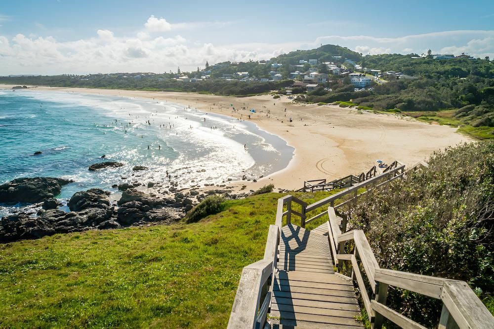 Wooden Steps Leading Down a Grassy Hill to a Sandy Beach — Lite Moves Furniture Removals In Bonville, NSW