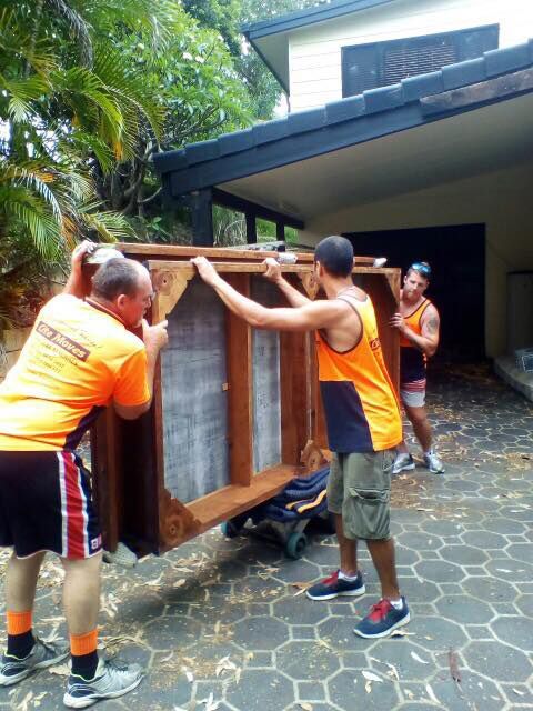 Delivery Men Moving Sofa In Room At New Home — Lite Moves Furniture Removals In Bonville, NSW