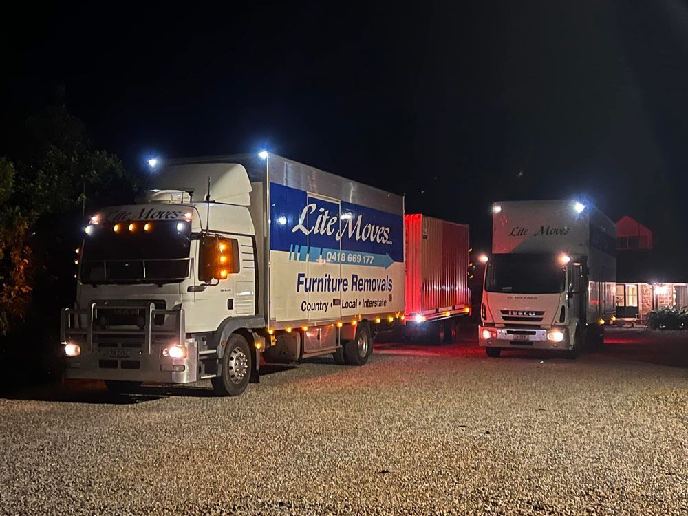 Two Furniture Removals Truck At Night — Lite Moves Furniture Removals In Bonville, NSW