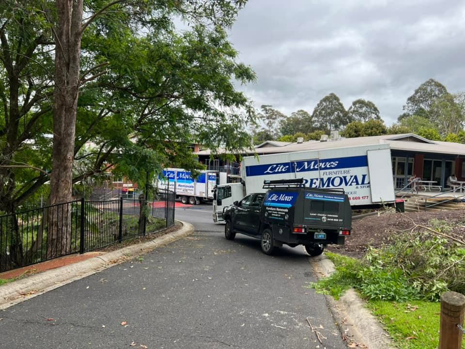 Two Truck Movers With Black Pick Up — Lite Moves Furniture Removals In Bonville, NSW