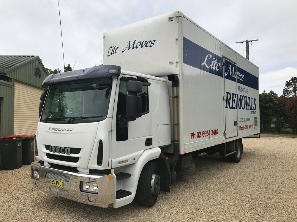 Open Car Trunk With Moving Boxes Outdoors — Lite Moves Furniture Removals In Bonville, NSW