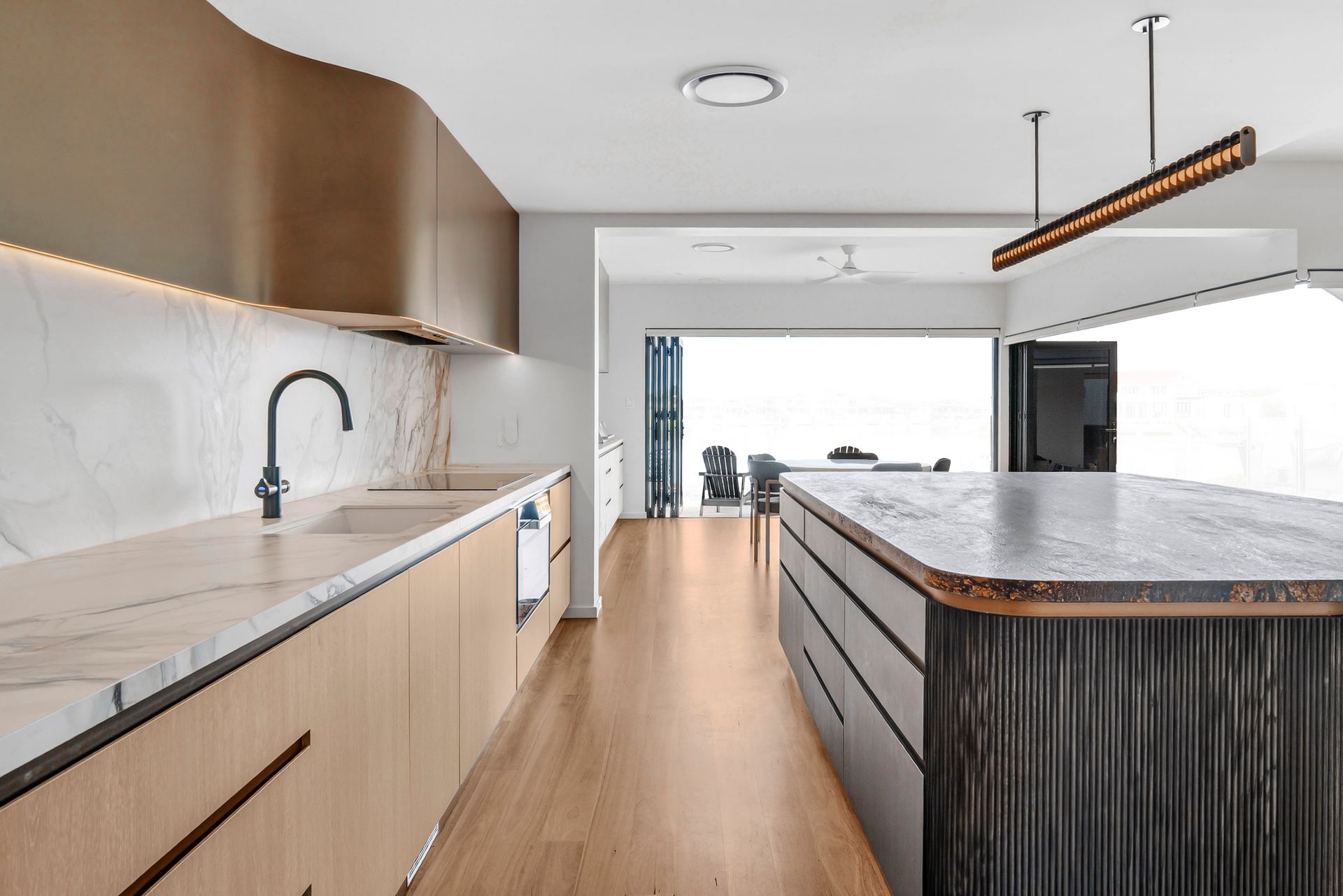 Modern kitchen with wood and marble finishes, island, and large windows — PK4 Projects in Port Macquarie, NSW