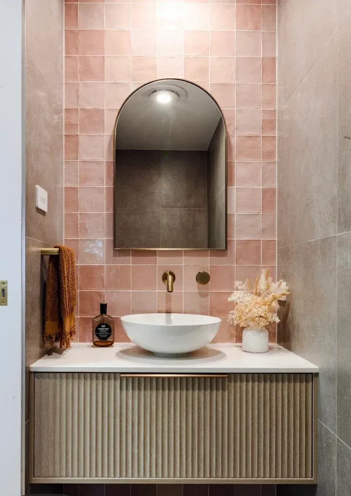 modern bathroom with pink tiles and a golden tap — PK4 Projects in Port Macquarie, NSW