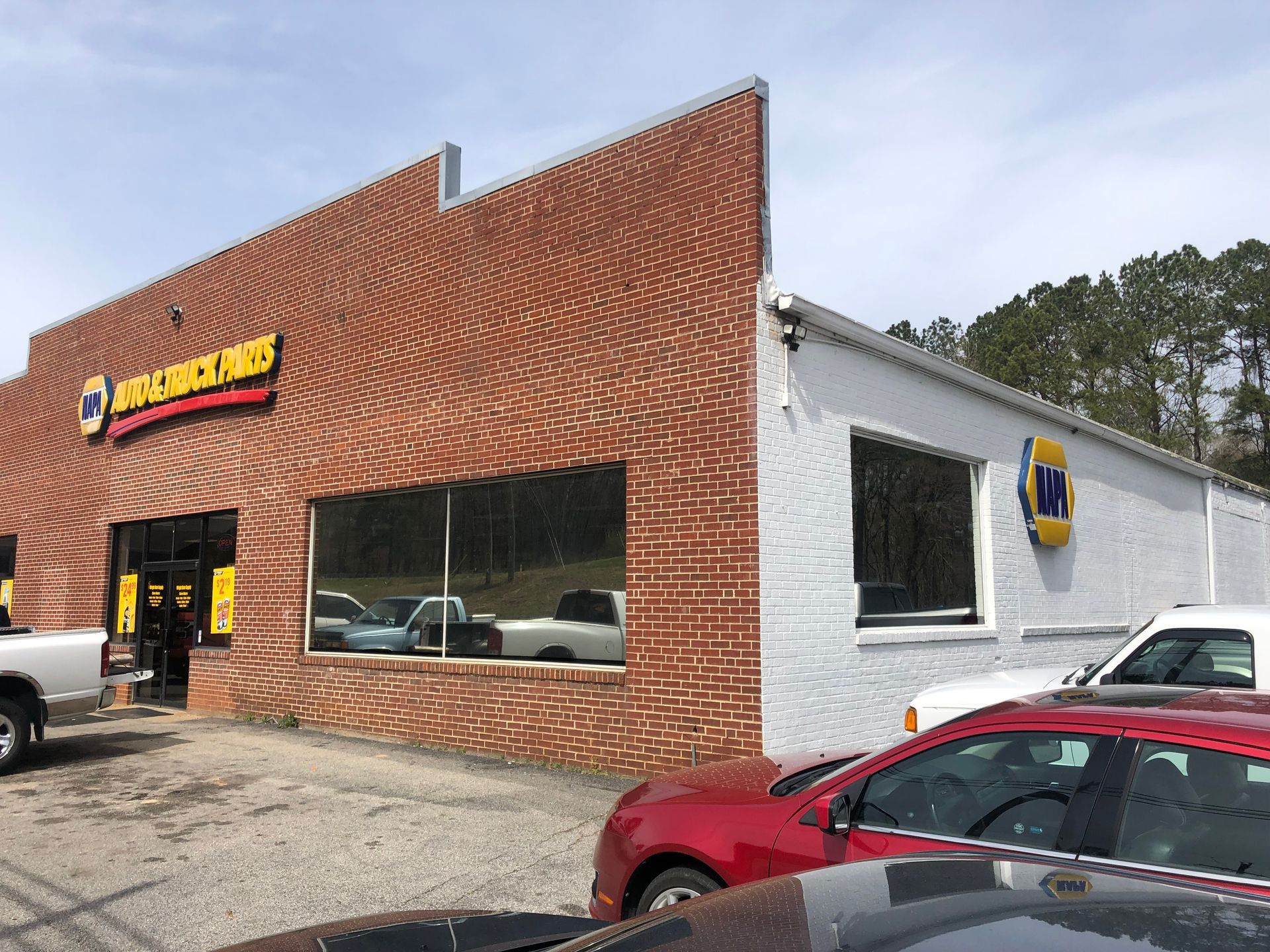 Brick and white building with a