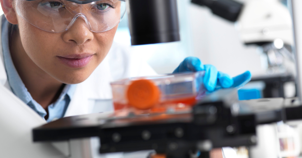 Scientist examining stem cell samples under a microscope in a Las Vegas laboratory for regenerative