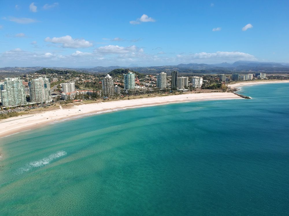 An Aerial View Of A Beach With A City In The Background — Sampson Plumbing Pty Ltd In Coolangatta, QLD