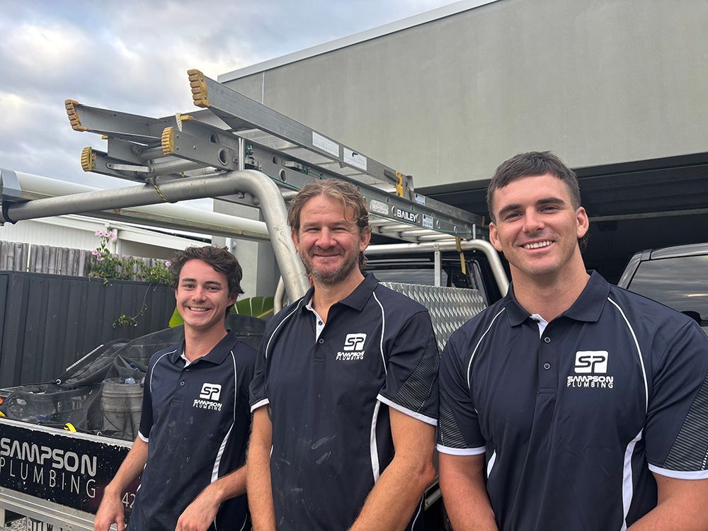 Three Men In Front Of A Plumbing Truck — Sampson Plumbing Pty Ltd In Pottsville, NSW