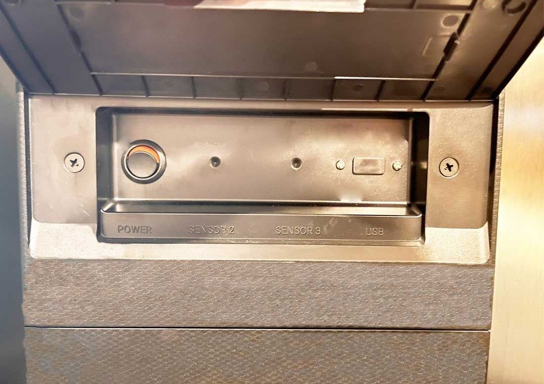 A stainless steel oven with a glass door and a digital display.