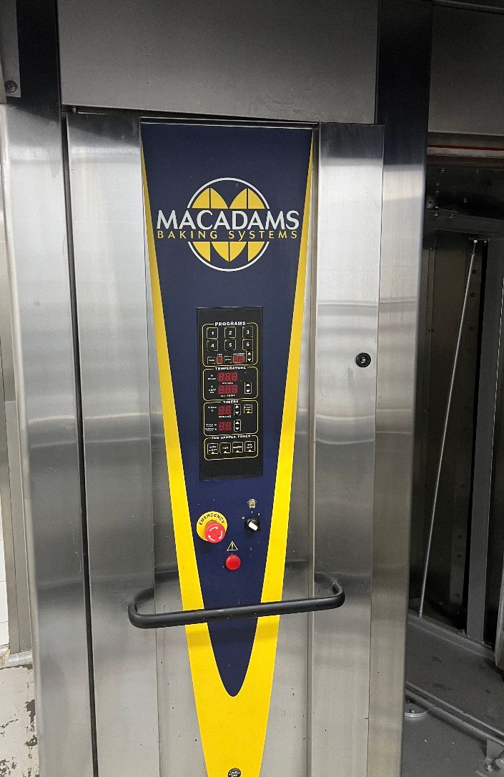 A macadamia oven is sitting in a warehouse