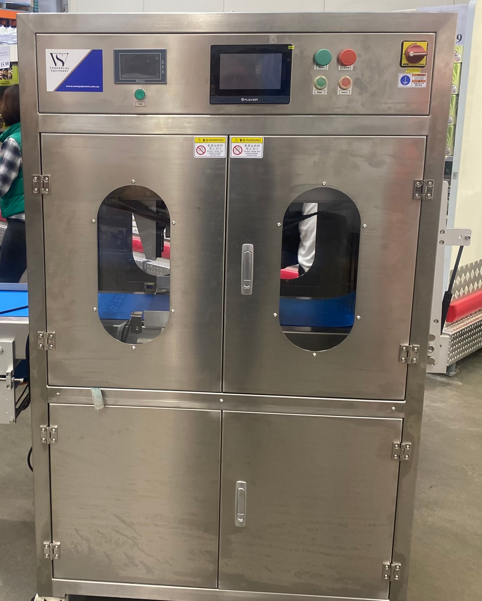 A stainless steel machine with the word mic on it