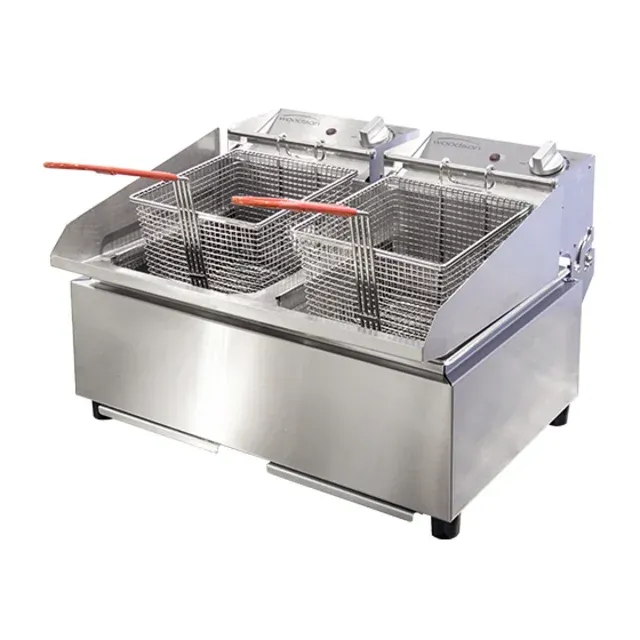A stainless steel fryer with two baskets and tongs on a white background.
