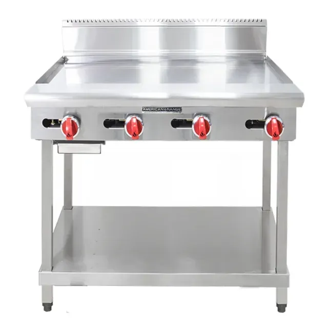 A stainless steel stove with red knobs on it