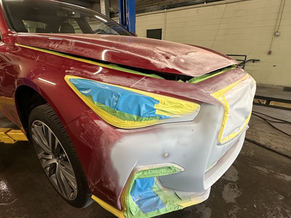 Red Car with Damaged Front | Peak Customs and Collision Inc
