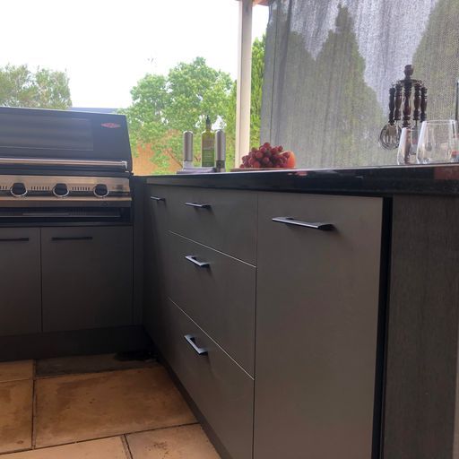 Resort-Style Outdoor Kitchen with a Poolside Bar and Tropical Landscaping — Shepparton Vic — Kitchenwise