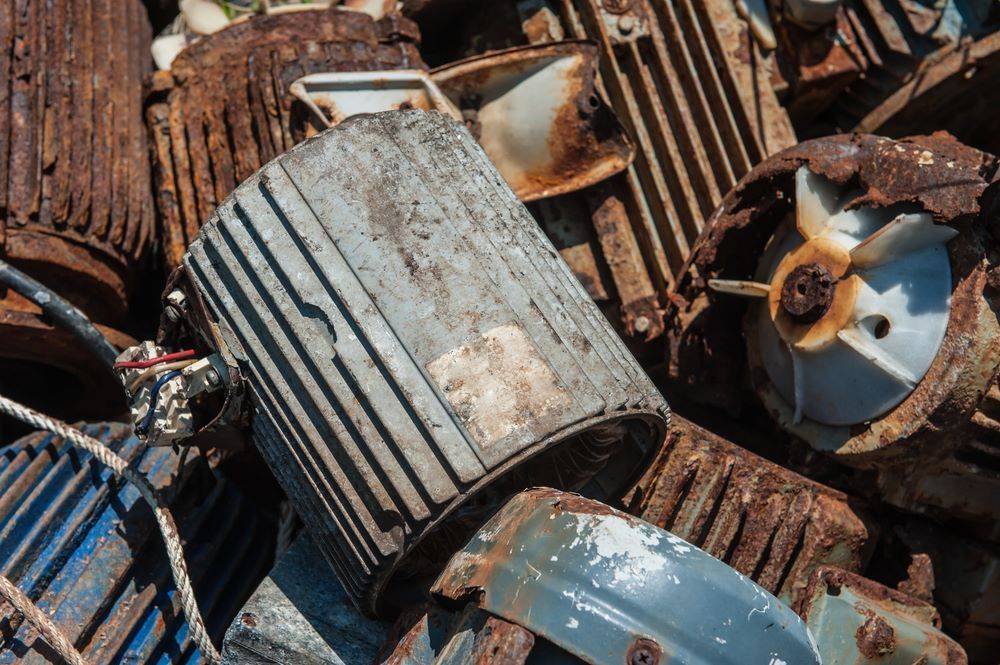 A Pile of Rusty Metal Parts Including a Motor — Bakers Creek Wreckers In Bakers Creek, QLD