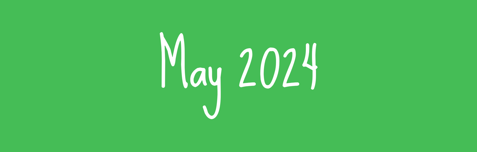 the word may is written in white chalk on a green background .
