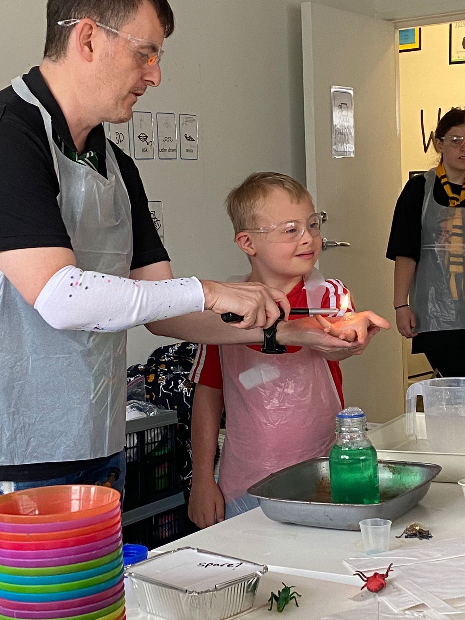 KS2 aged boy with Down syndrome enjoying a fun science session with Down Syndrome Cheshire