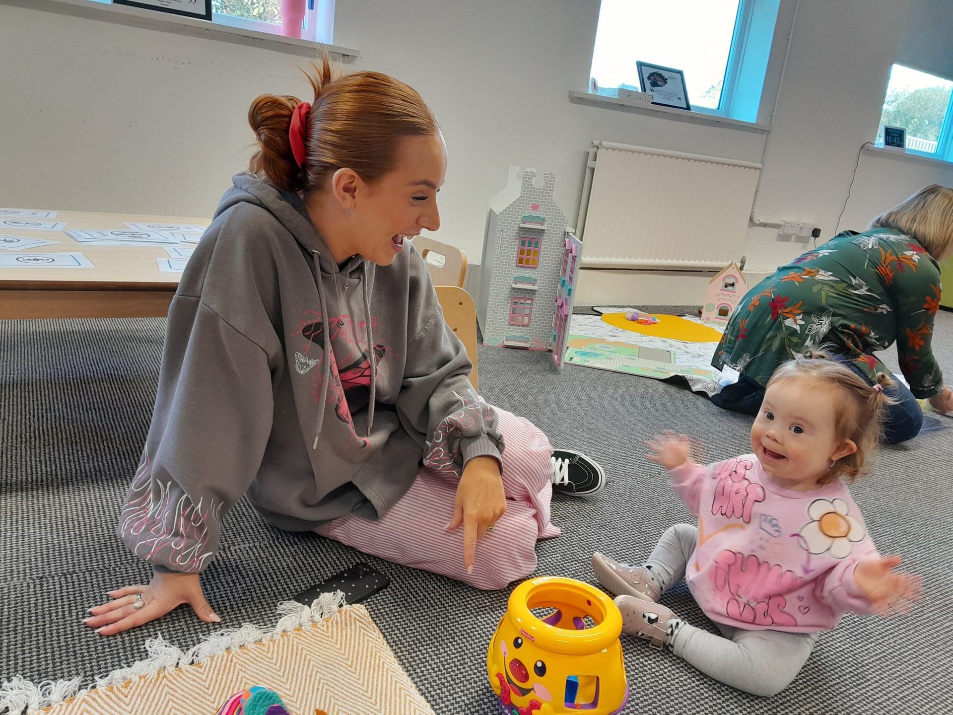 A mother and toddler with Down syndrome