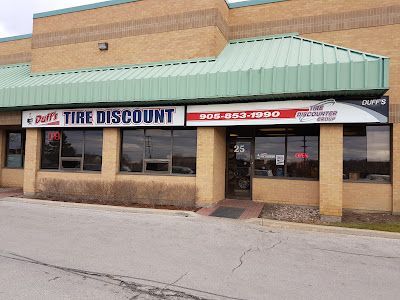 A tire discount store is located in a brick building
