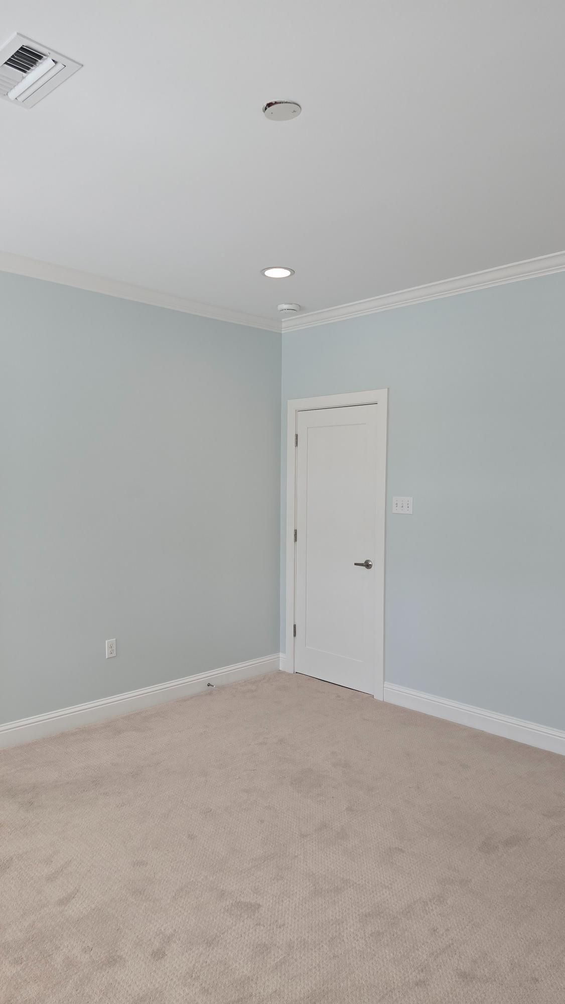 There is a door in the corner of the room.