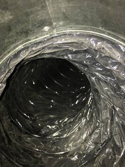 A close up of a plastic bag with a hole in the middle.