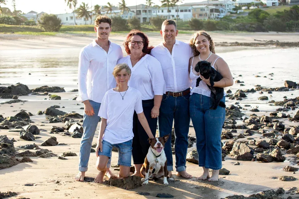 A Family Photo With 5 People and 2 Dogs — Buggies & Batteries in Hidden Valley, QLD
