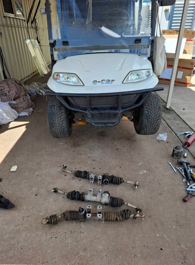 Golf Cart With Detached Steering Racks on a Concrete Floor — Buggies & Batteries in Moranbah, QLD