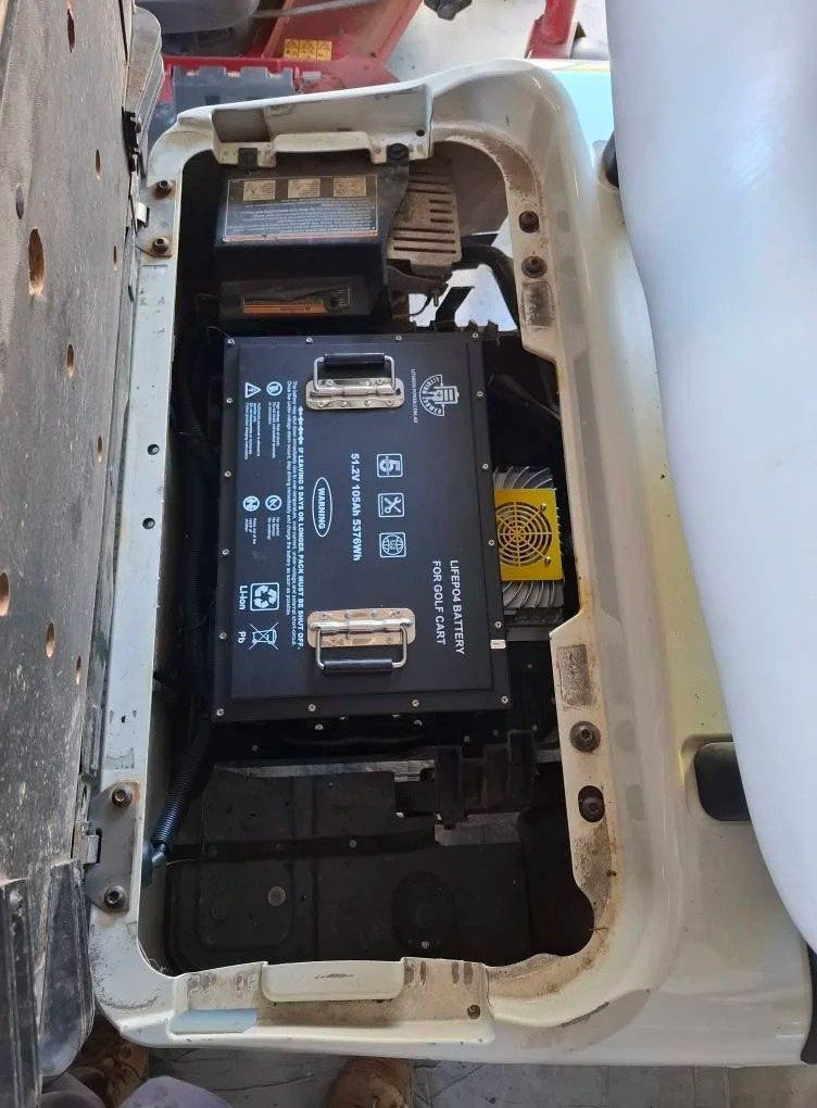 A Golf Cart With the Trunk Open and a Battery in It — Buggies & Batteries in Rockhampton, QLD