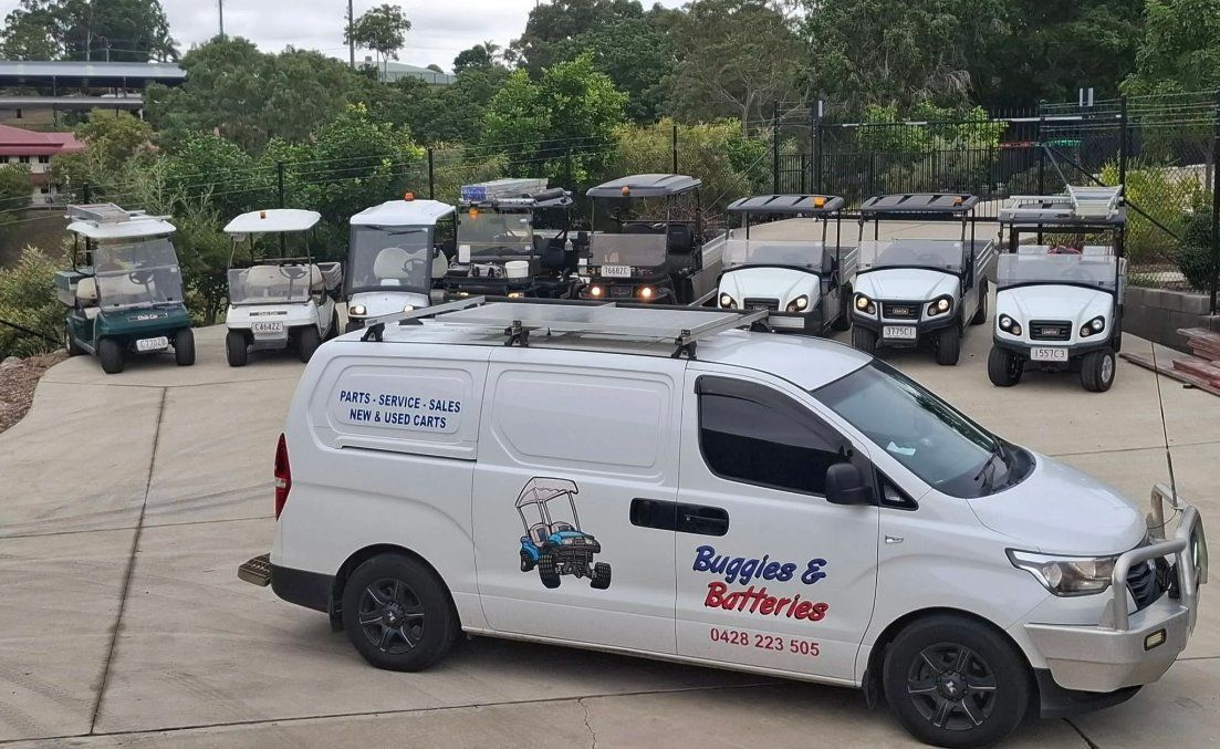 A White Van is Parked in Front of a Row of Golf Carts — Buggies & Batteries in Rockhampton, QLD