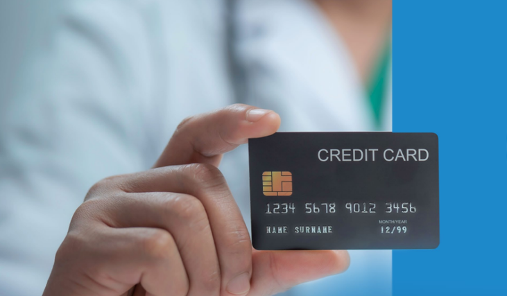 Person uses phone to make a contactless payment at a shop.