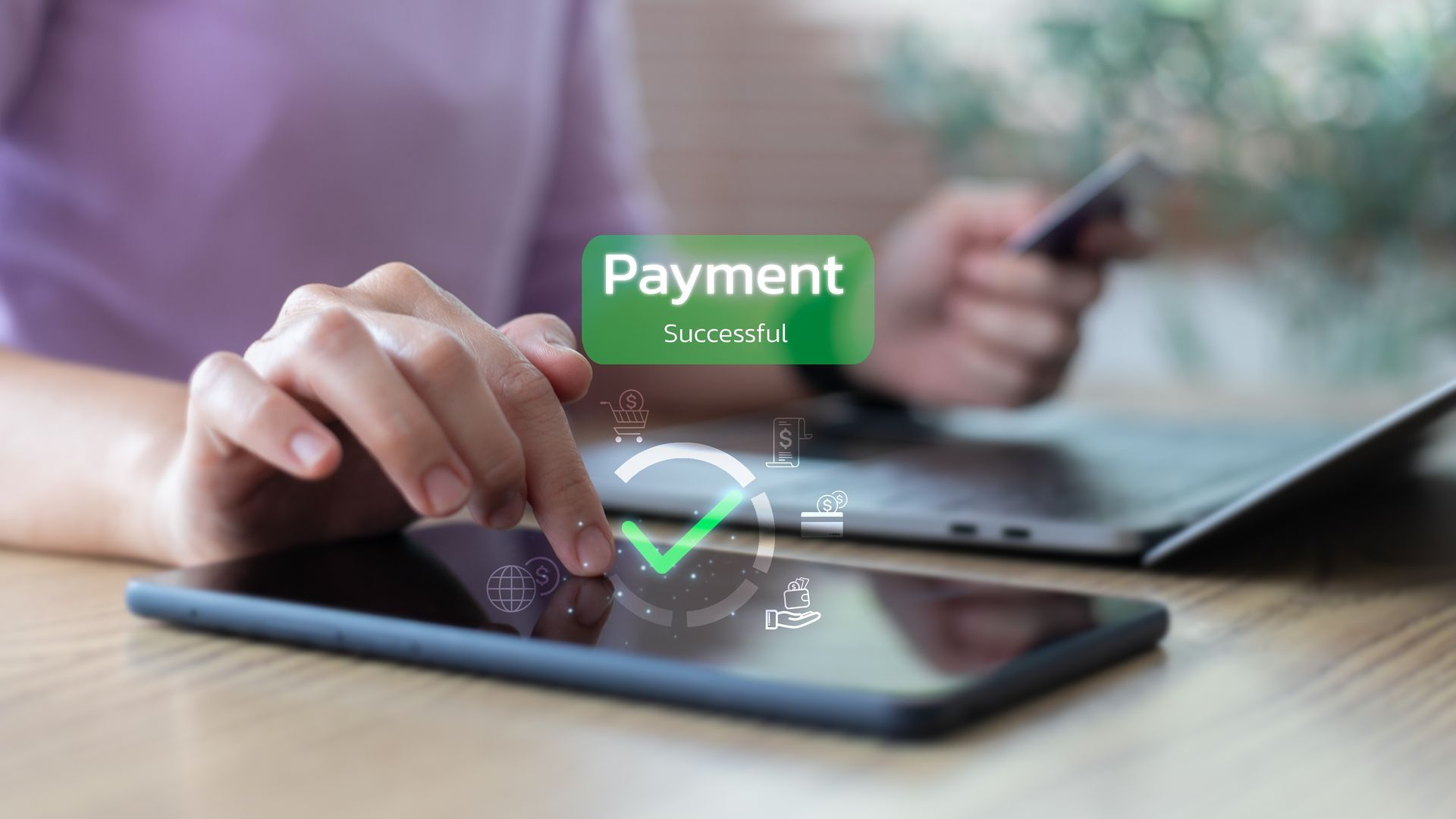 Person making online payment on smartphone with credit card and laptop.