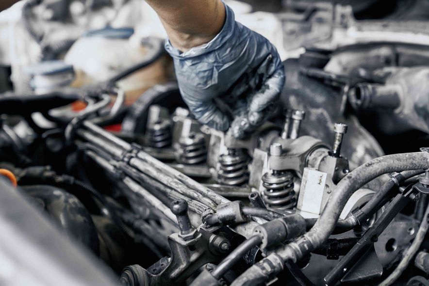 A mechanic working on the engine