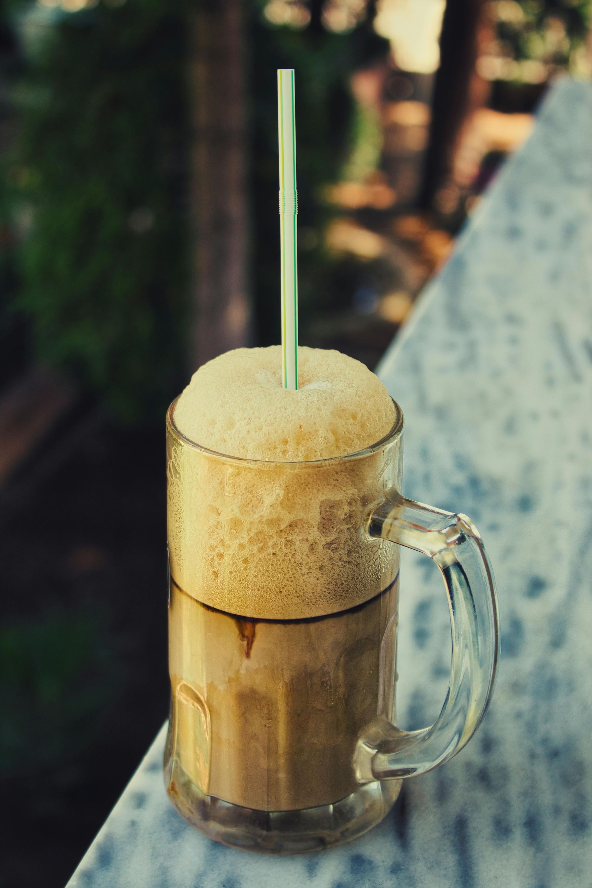 Picture of a root beer float with a straw