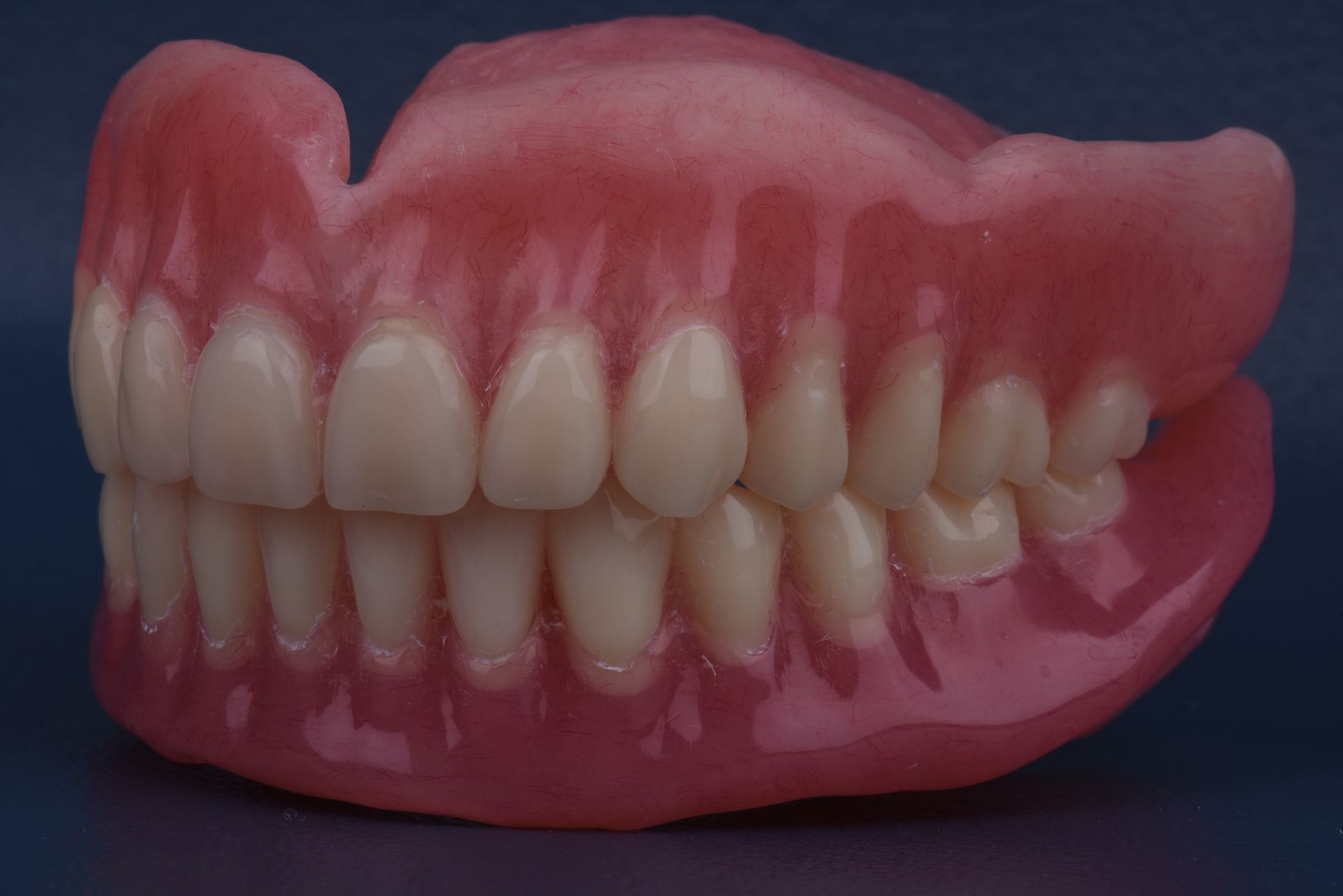 Close-up of a Full Set of Pink Dentures