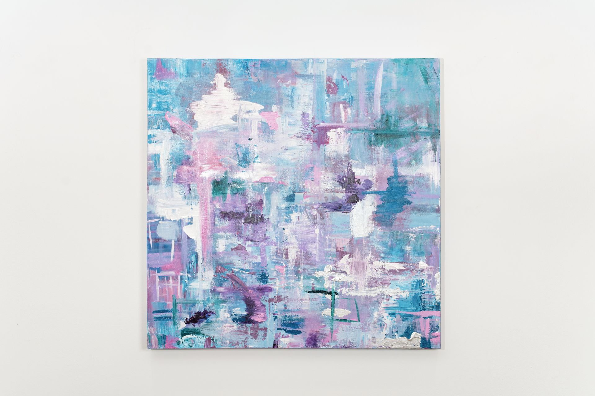 A blue and purple abstract painting is hanging on a white wall.