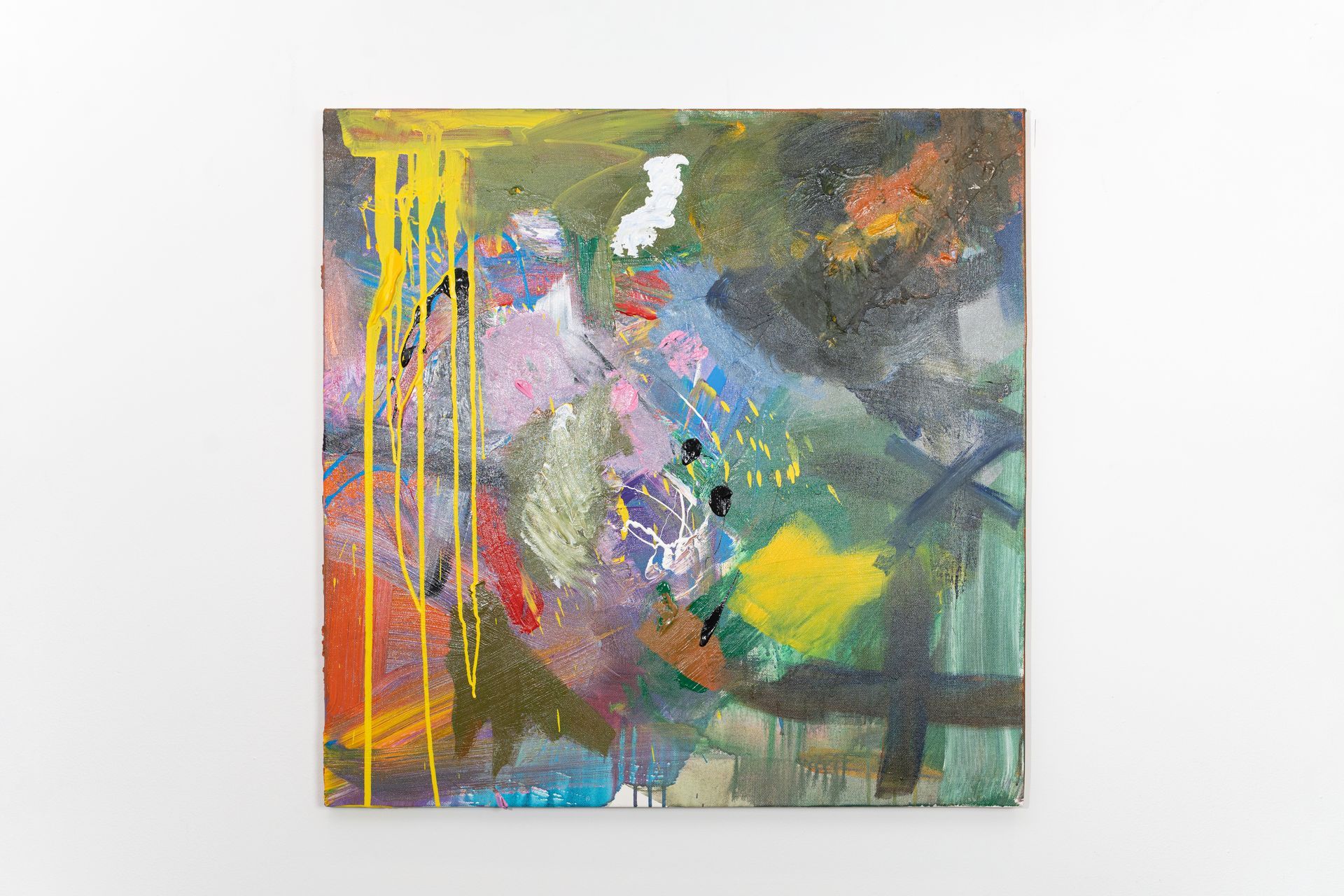 A colorful painting is hanging on a white wall.