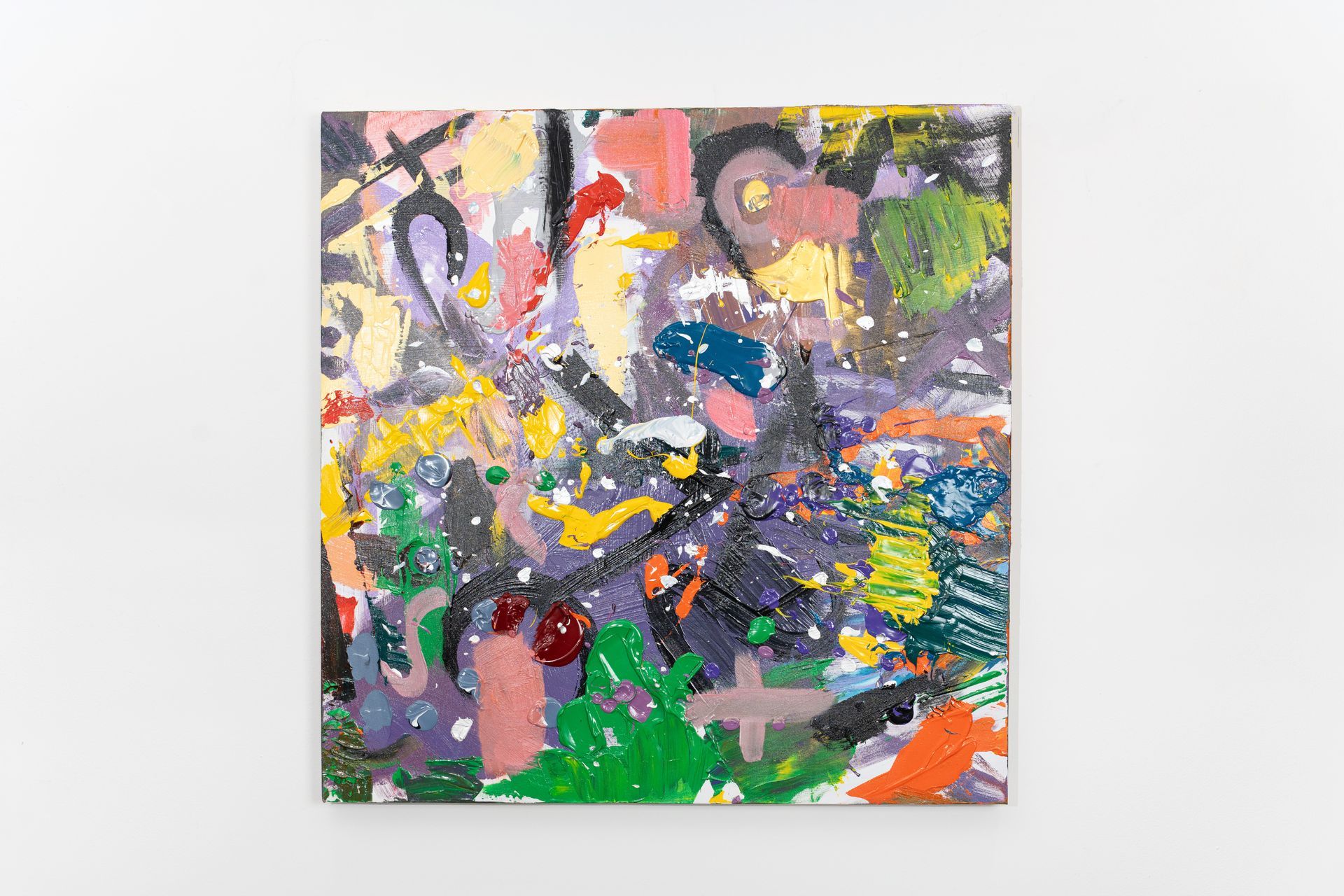 A colorful painting is hanging on a white wall.