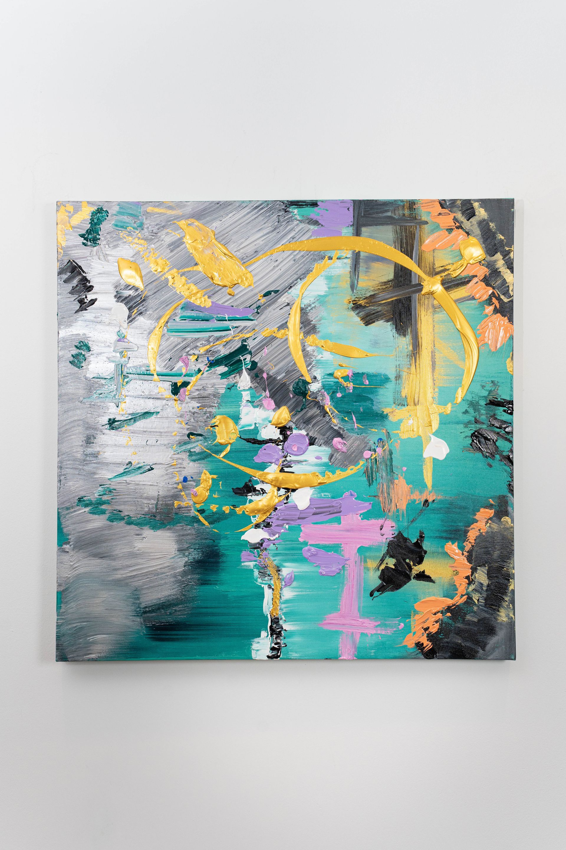 A colorful painting is hanging on a white wall.