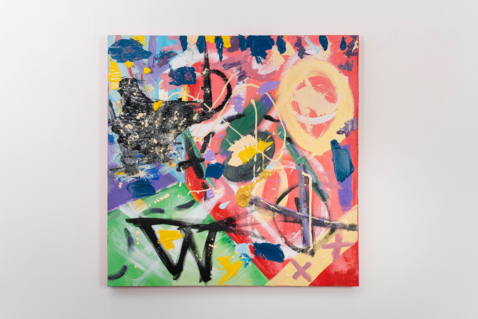 A colorful painting is hanging on a white wall.