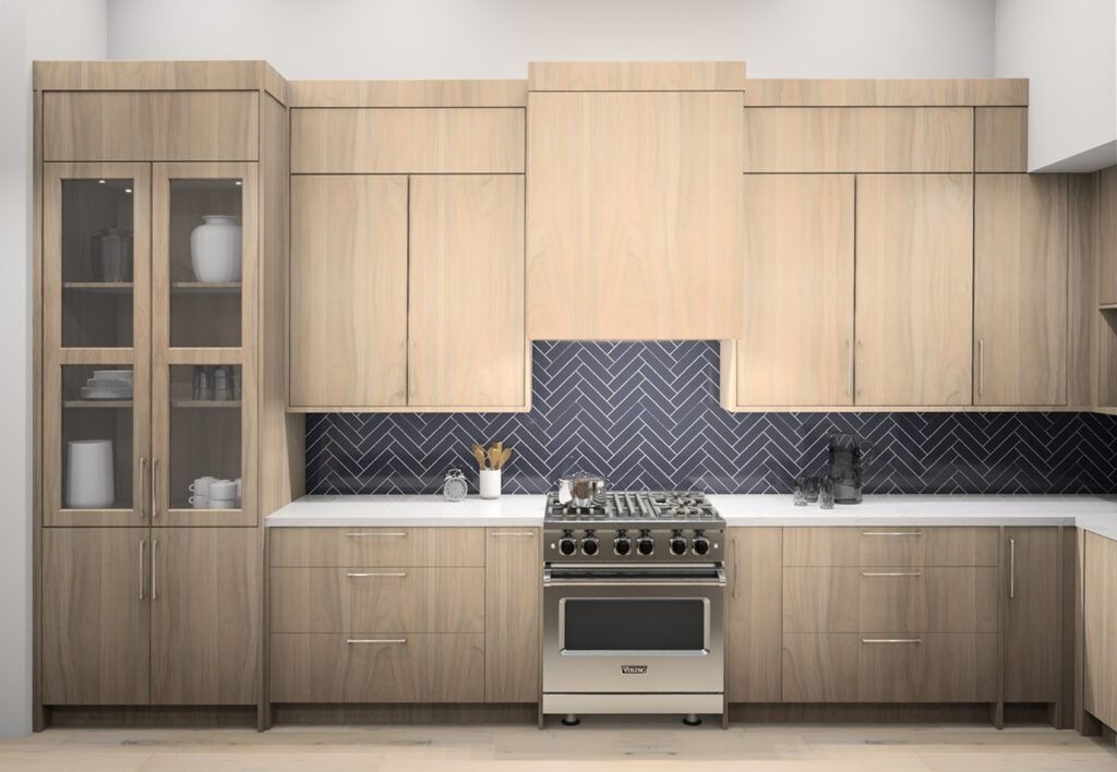 Modern kitchen with light wood cabinets, stainless steel range, and dark blue chevron backsplash.