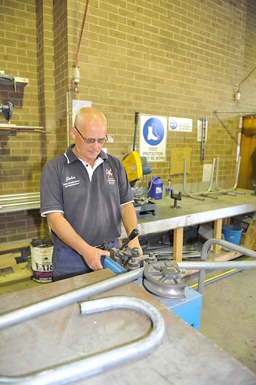 Man Fabricating the Handrail — Home Modification Services In Byron Bay, NSW