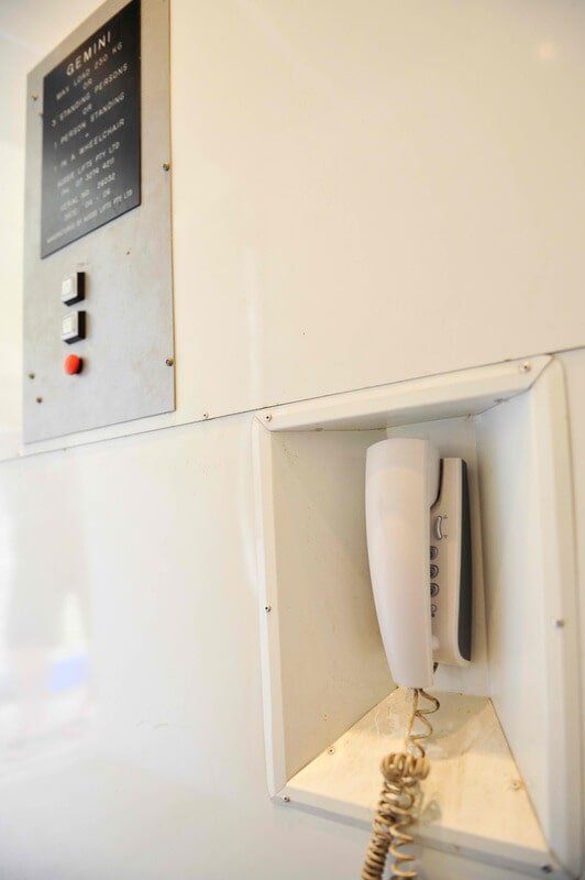 Home Lift Button and Telephone — Home Modification Services In Byron Bay, NSW