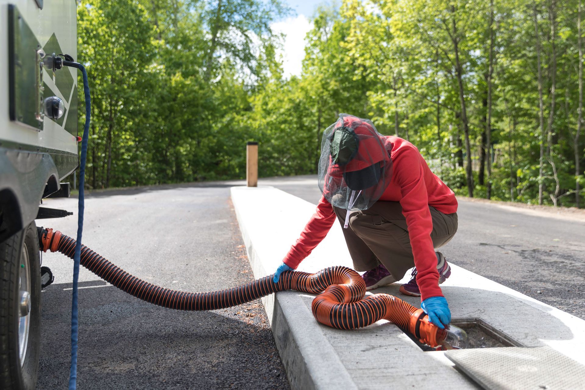 Man Removing Water With Hose | Mobile, AL | VetCor Services