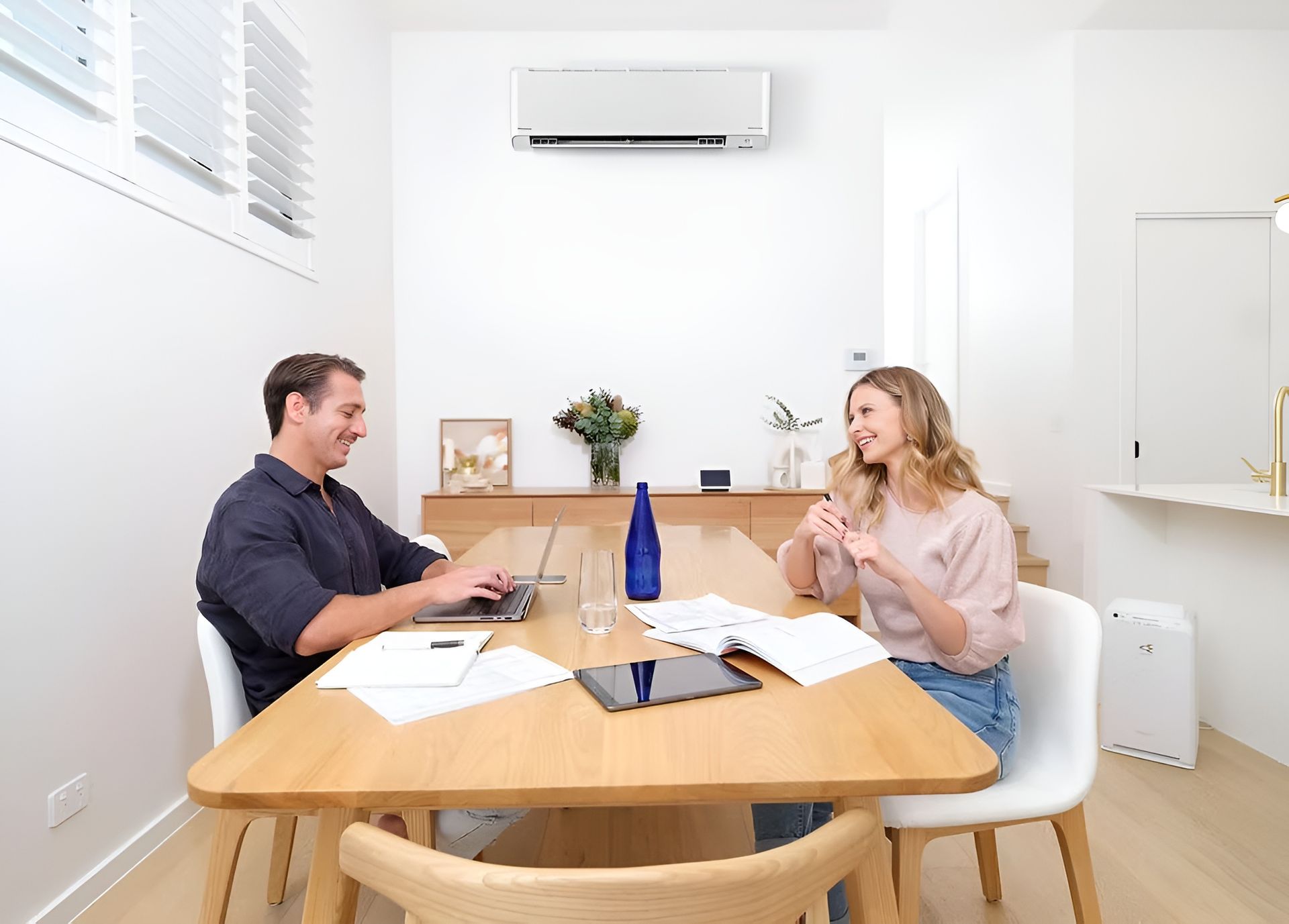 Family in A Modern Kitchen with A Dog, Gathering in a Kitchen Island — Frostys Air-Conditioning Services in Cannonvale, QLD
