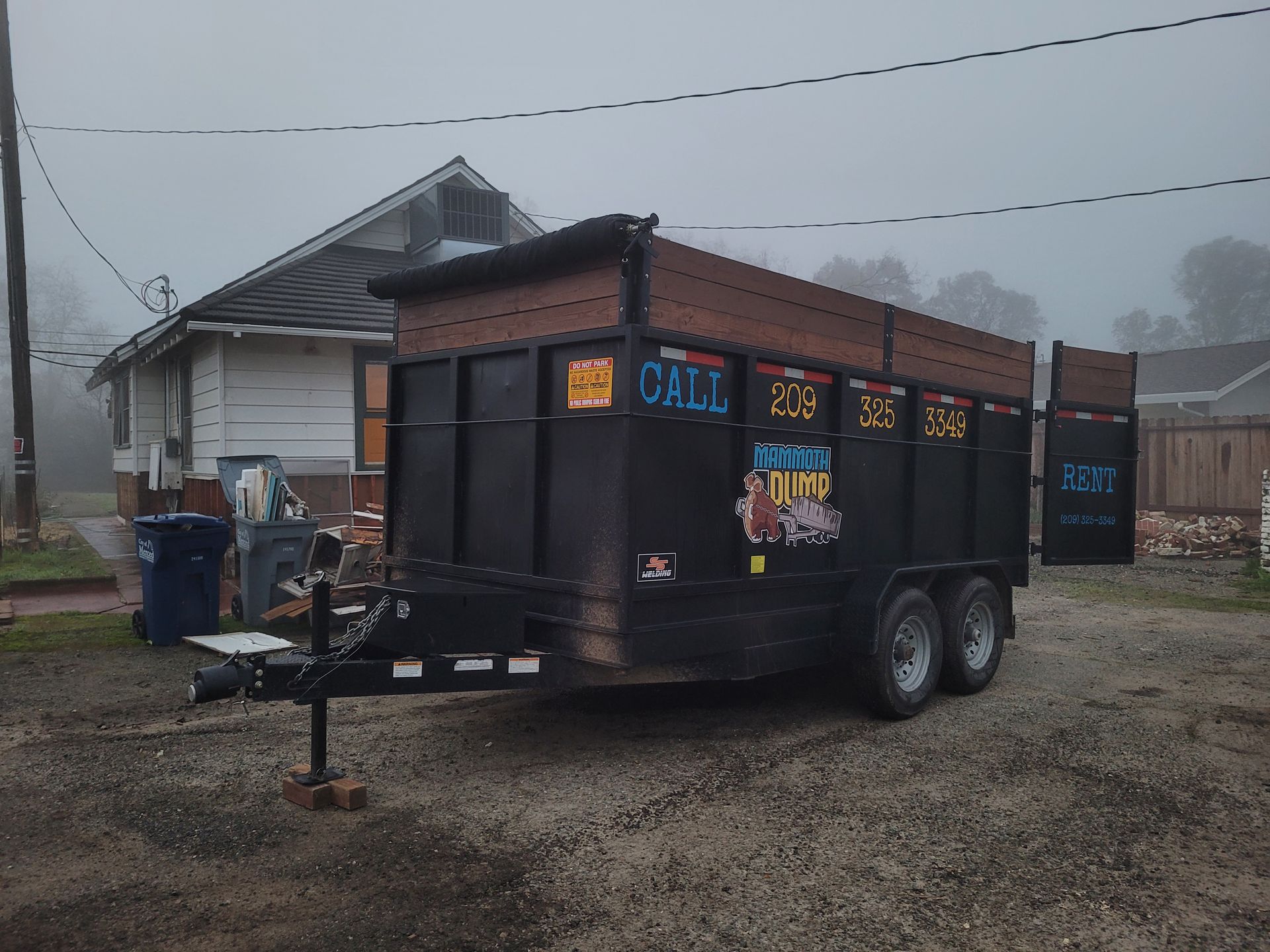20 yard dumpster in front of residential home