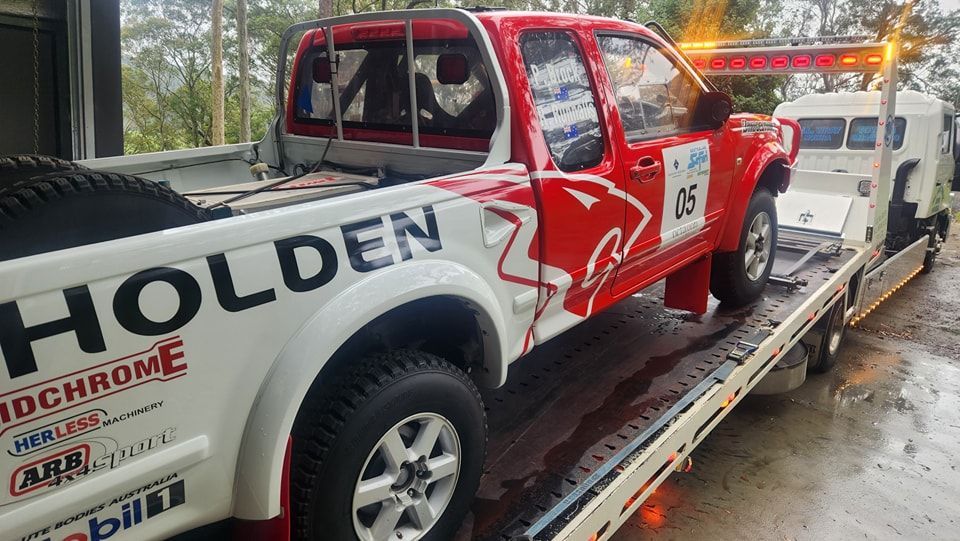 Red and White Holden Pickup Truck on a Tow Truck — M.L. Wray Towing & Automotive Repairs in Culburra Beach, NSW