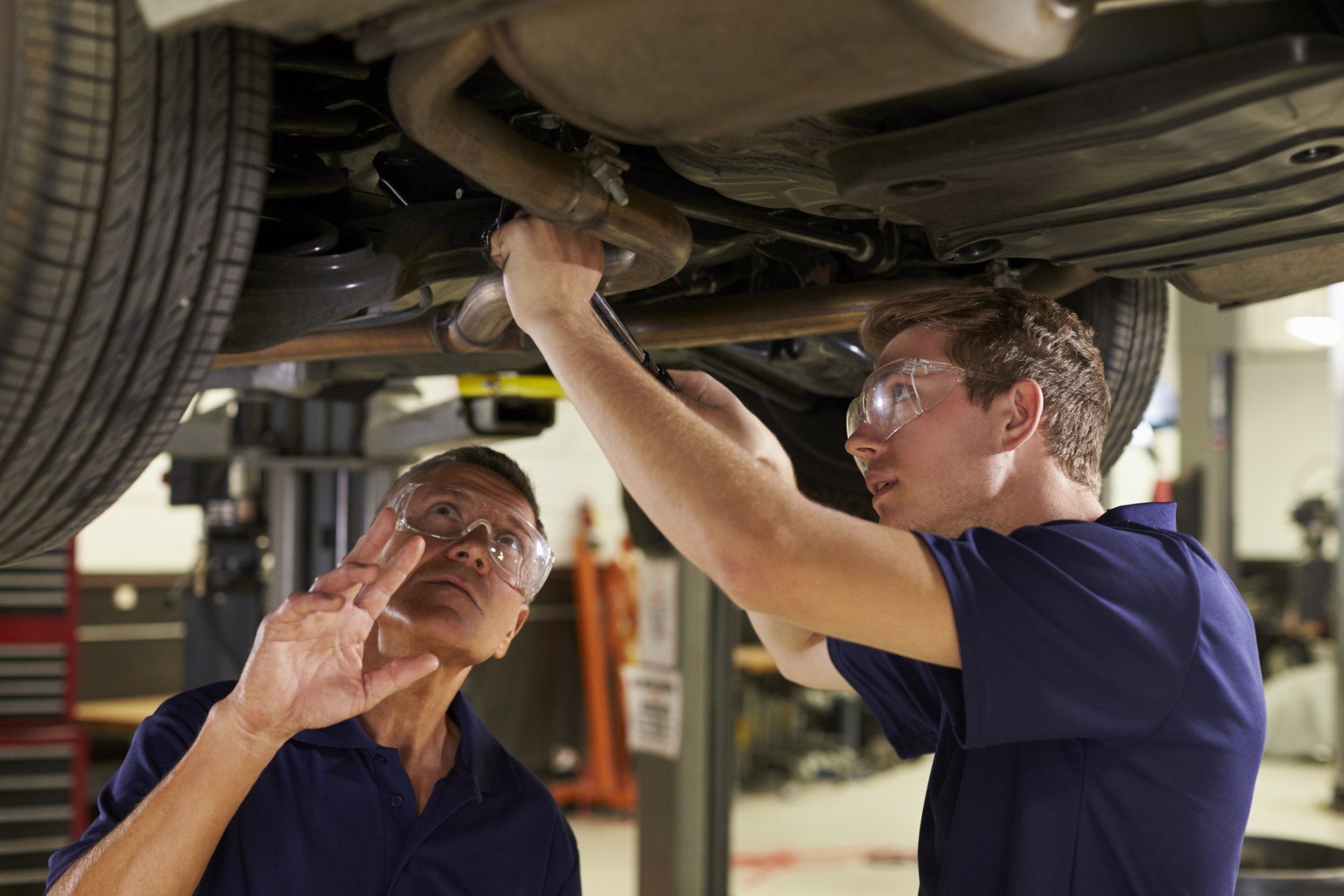 Custom Exhaust — Two Male Mechanic Underneath Car in Morristown, TN