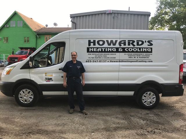 Man stands beside white van with 